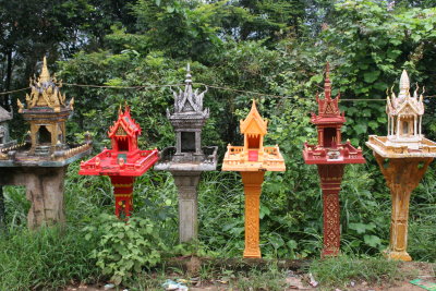 lots of spirit houses on road to Phnom Penh