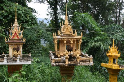 lots of spirit houses on road to Phnom Penh