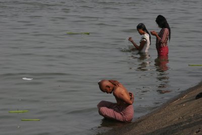 people bathing in Tonle Sap river