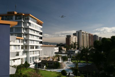 plane landing over Hotel Quito