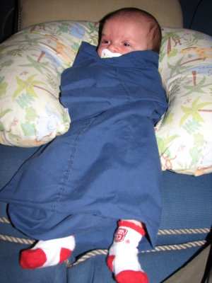Hanging out at Andy's - swaddled in a pillowcase!