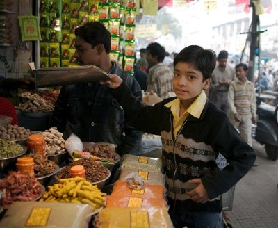Young boy selling spices