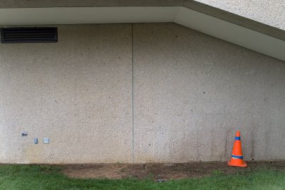 wall and orange cone