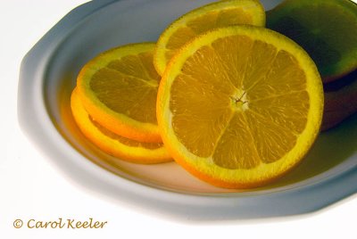 Oranges on White Plate