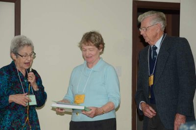 Fenja giving President's Prize to Gerry and Roy Millen