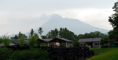 Mount Merapi, an active volcano, is visible from Prambanan