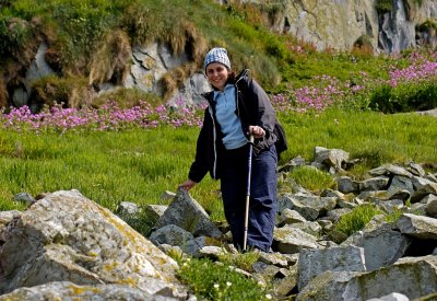 Nora pauses on the steep slope down