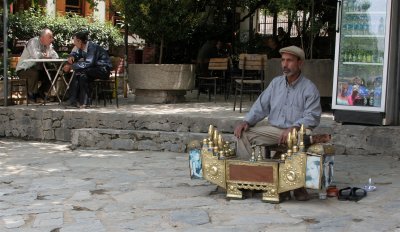 Shoe-shiner waiting for business