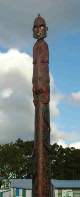 A totem pole displayed in front of the school