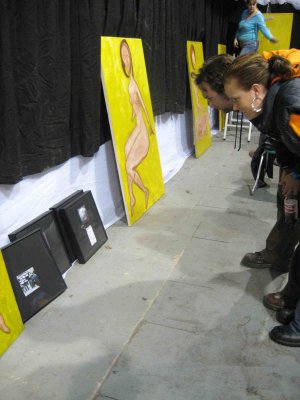 the artist admires her artwork