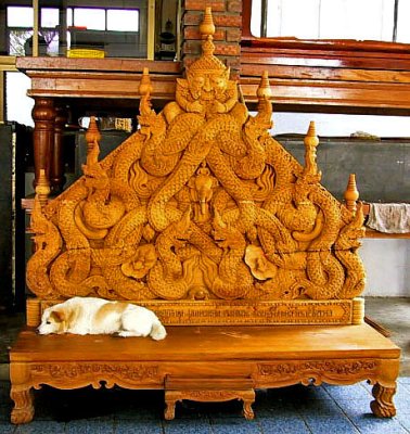 Dog on carved bench