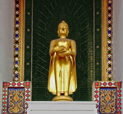 Small Buddha image outside temple