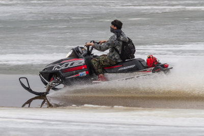 Snowmobile on the ice of the Moose River 2013 May 1st