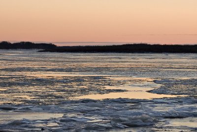 Sunset reflected on water and ice