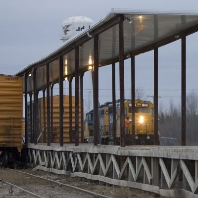 Mixed train seen through freight platform