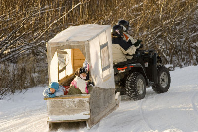 ATV with sled heading up McCauley's Hill in Moosonee