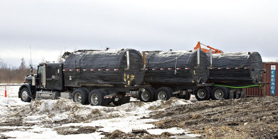 Water carrying trucks used in winter road construction