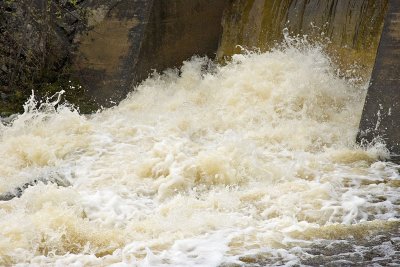 Faster exposure shot of water at dam along Highway 573