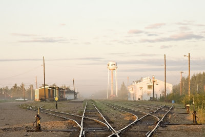 Sun lifting fog around Moosonee rail yard