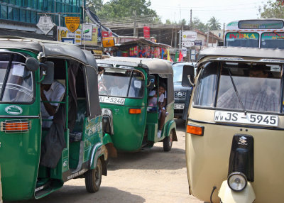 Trishaws waiting at level crossing, Maho