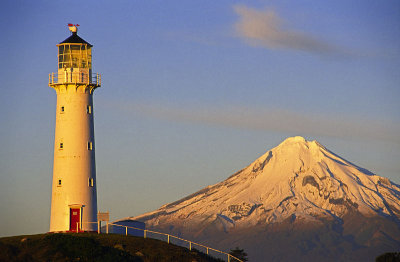 Cape Egmont Lighthouse and Mount Taranaki at sunset, Taranaki, New Zealand