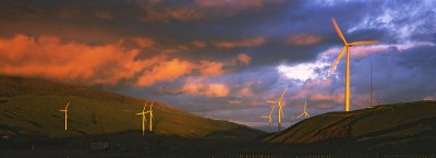 Sunset colours on wind turbines, Manawatu, New Zealand