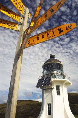 Cape Reinga lighthouse and signpost, Northland, New Zealand.