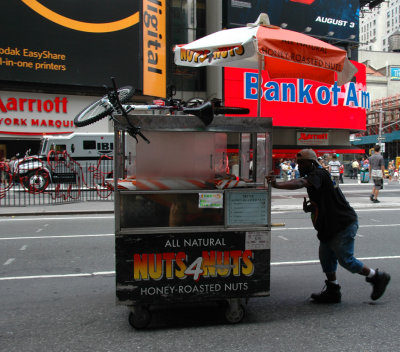 Pushing the cart - Times Sq. in the morrning