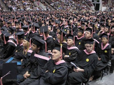 Some of the 873 graduates listen to Gloria