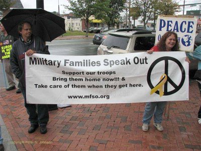 Peace activists hold sign