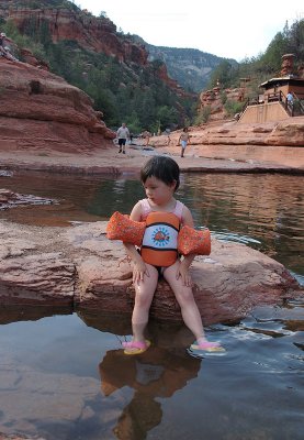 Emma prefers sitting on the rocks.
