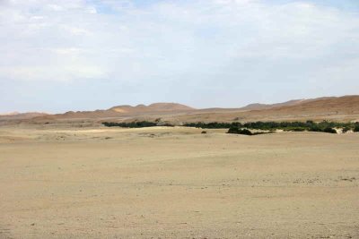 The Kuiseb river bed snakes across the desert plain