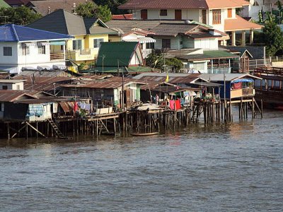 Shanty town housing on the bank of the Chao Phraya river in Bangkok