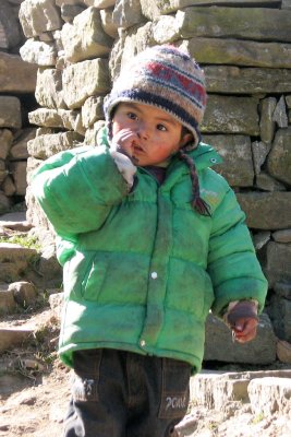 Nepali kid digging nose