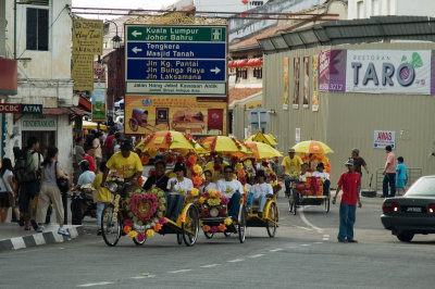 Trishaw convoy making its way in Melaka