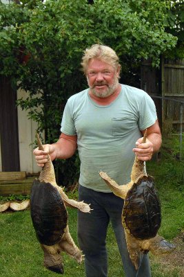 Bill Perkins with two 25lb+ snapping turtles. June 2007 Madison County
