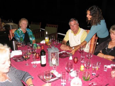 Anita clearing the table