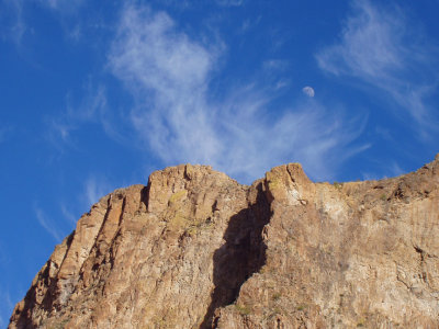 Cliff, clouds, and Earths largest satellite
