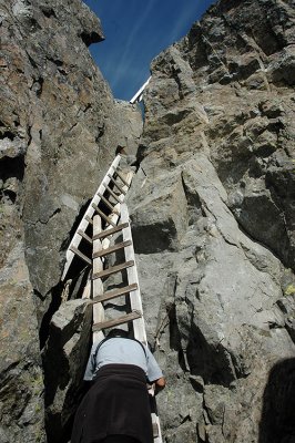 Hiker Descending Ladders