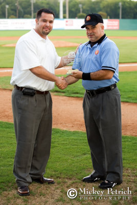 Chris Allen, COO of the South Coast League, presents Ron Russo with the Umpire of the Year Award
