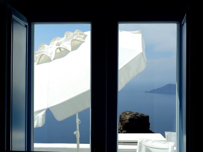 Santorini - Umbrella through the windows