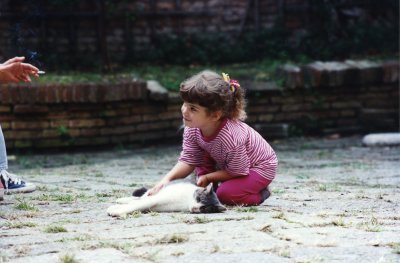 petting the kitties in italy...age 4