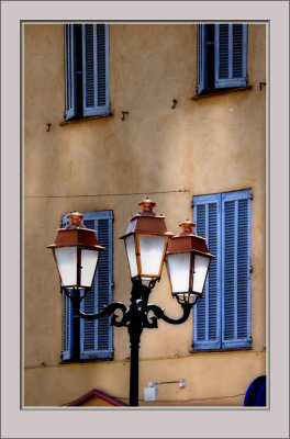 Four Blue shutters and a Lampost