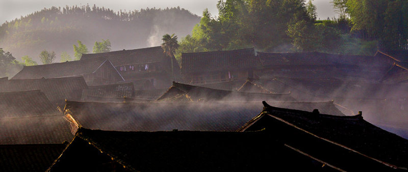 2509 Sunrise across the roofs of the village.