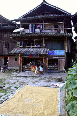 0429 Home and store with rice drying. ***Explanation***