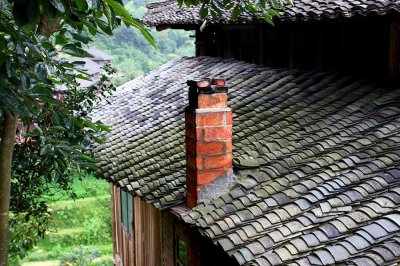 1217 Typical brick chimney and fired clay tile roof.