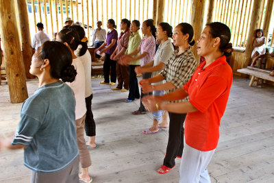 0576 Women practice singing and dancing.