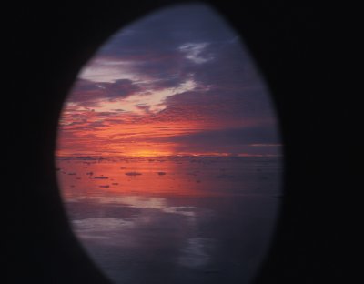 East Greenland pack ice sky from porthole