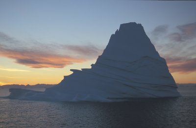 Scoresbysund sunset with iceberg