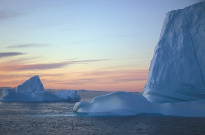 Scoresbysund sunset with iceberg